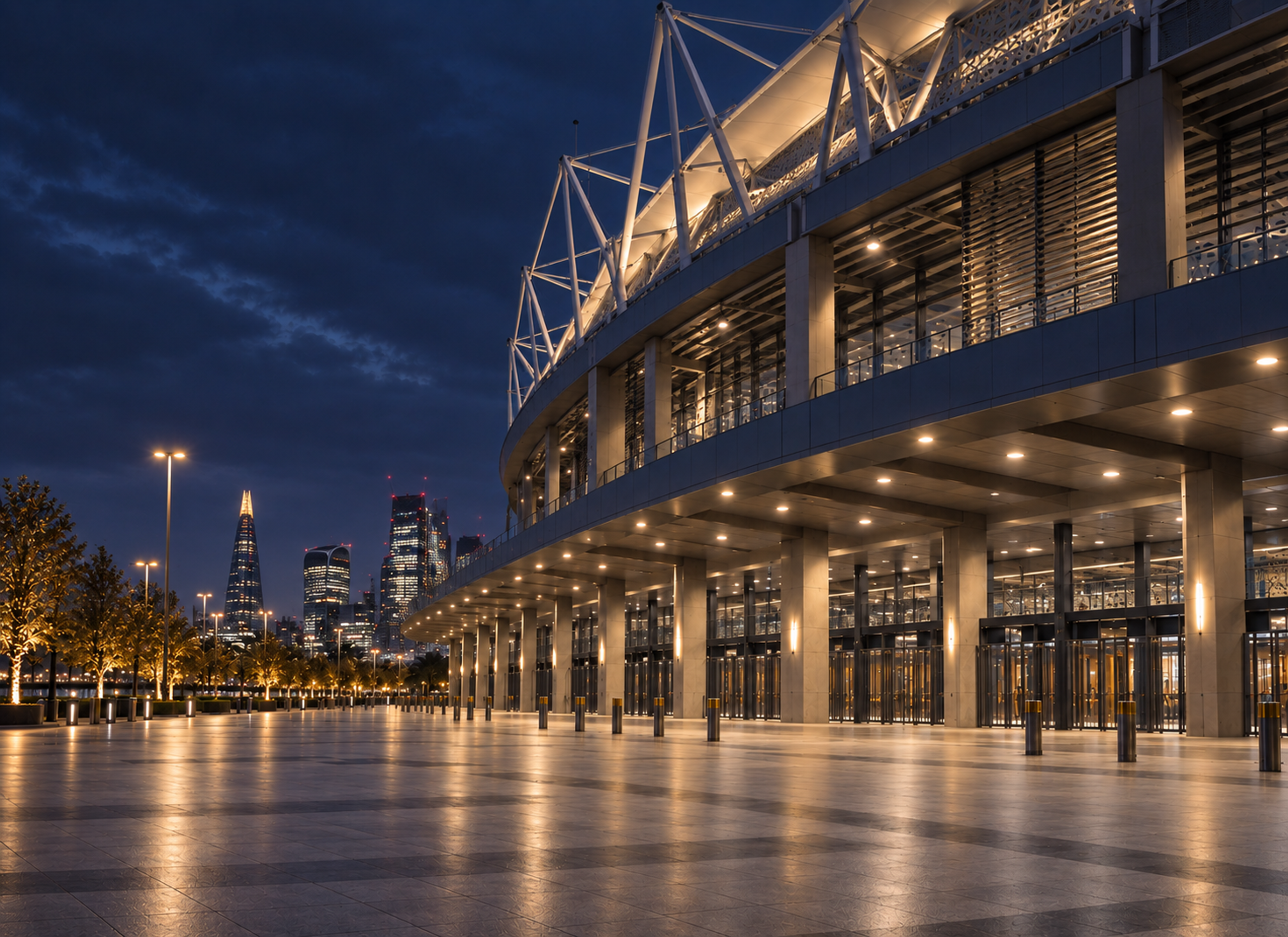 Photograph: a stadium concourse before doors, lit and empty. Dark and cool, no text in the artwork.