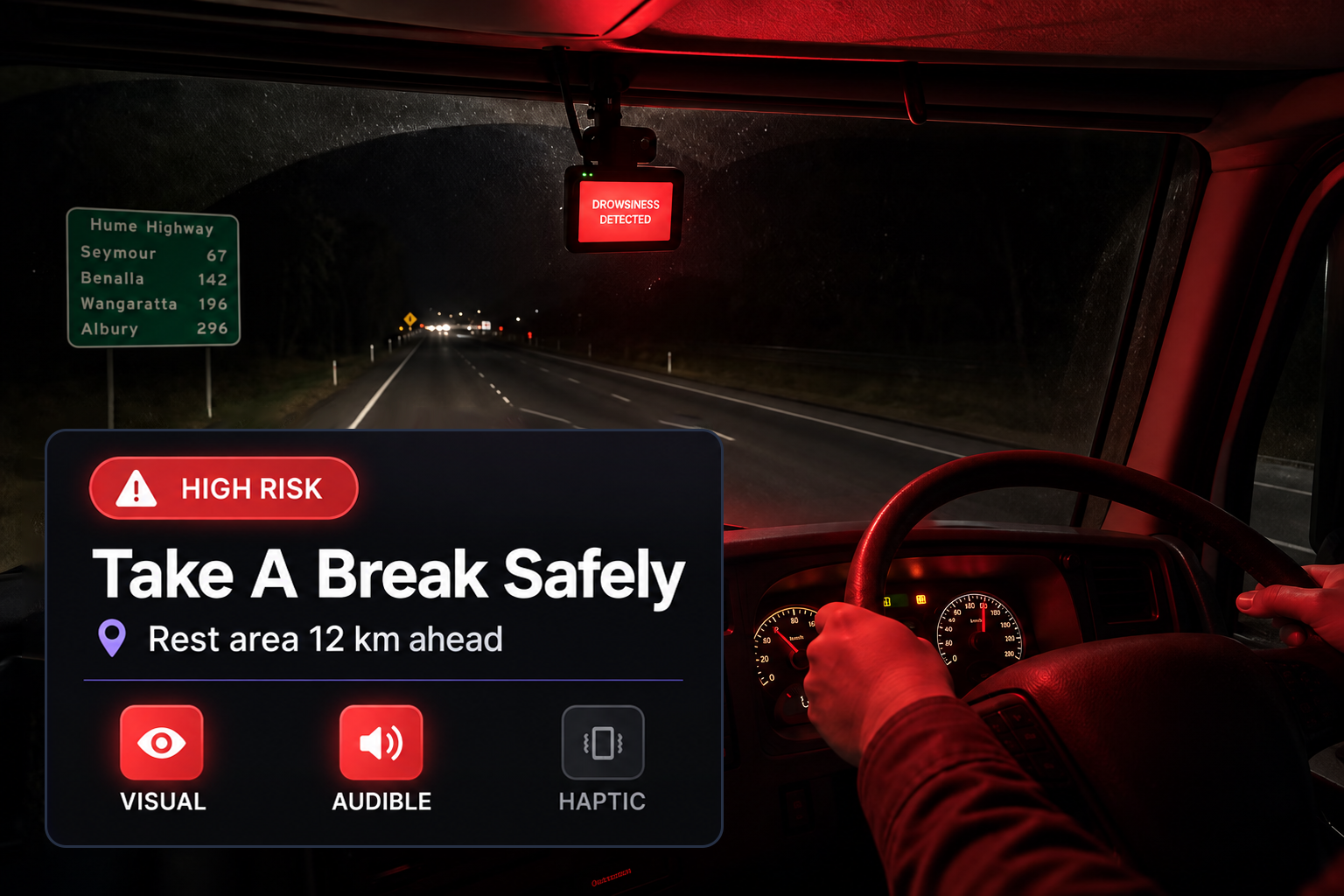In-cab display showing a drowsiness detected warning with a take a break safely prompt, above the visual, audible and haptic alert icons. 4:3, dark UI.
