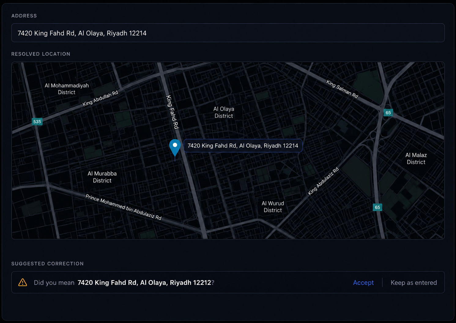 Address validation panel with the resolved pin and the suggested correction. 16:9, dark UI.