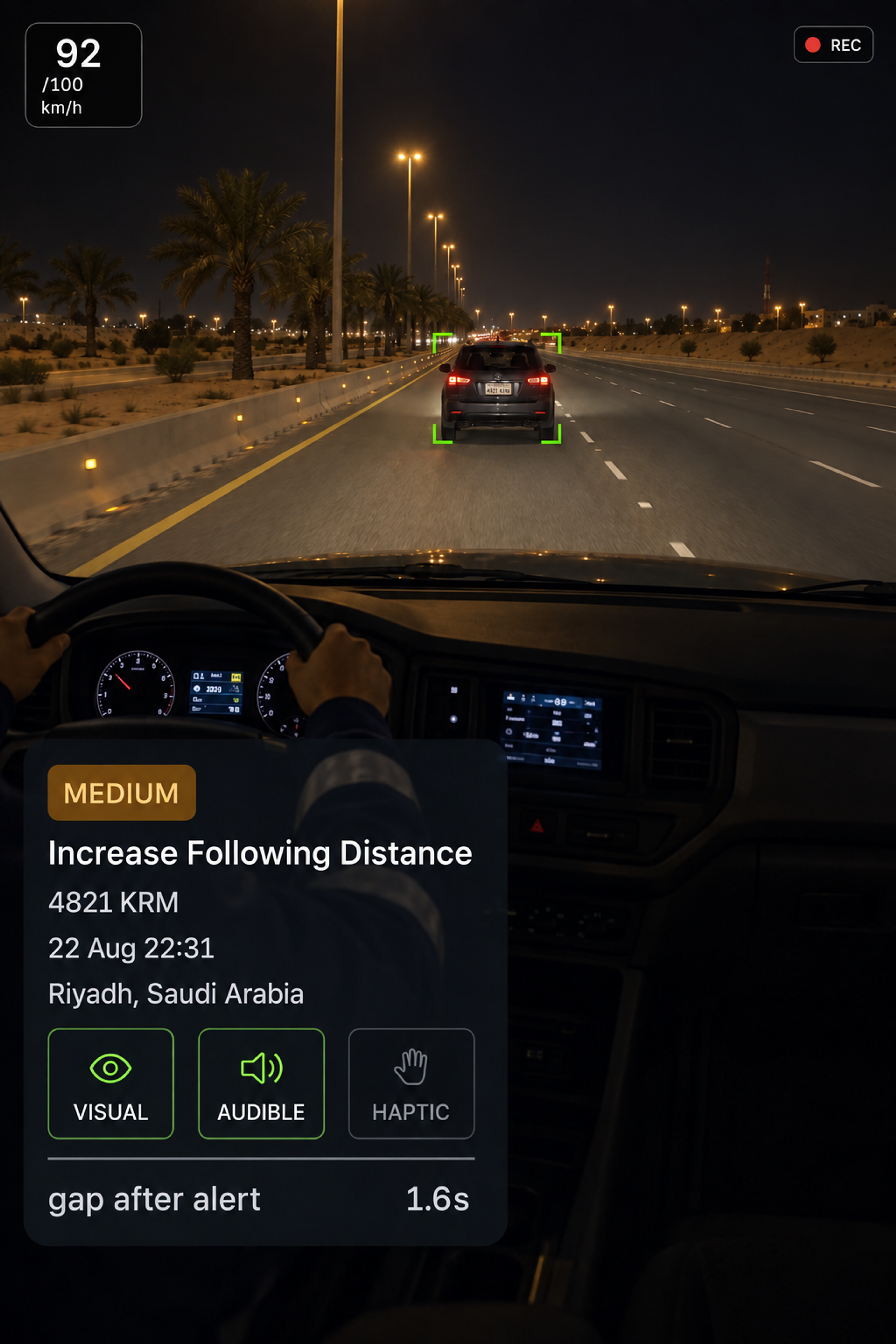 Photograph: a truck cab interior with the in-cab display lit on the dash. Portrait 3:4, dark and cool, room at the top for a heading, no text in the artwork.