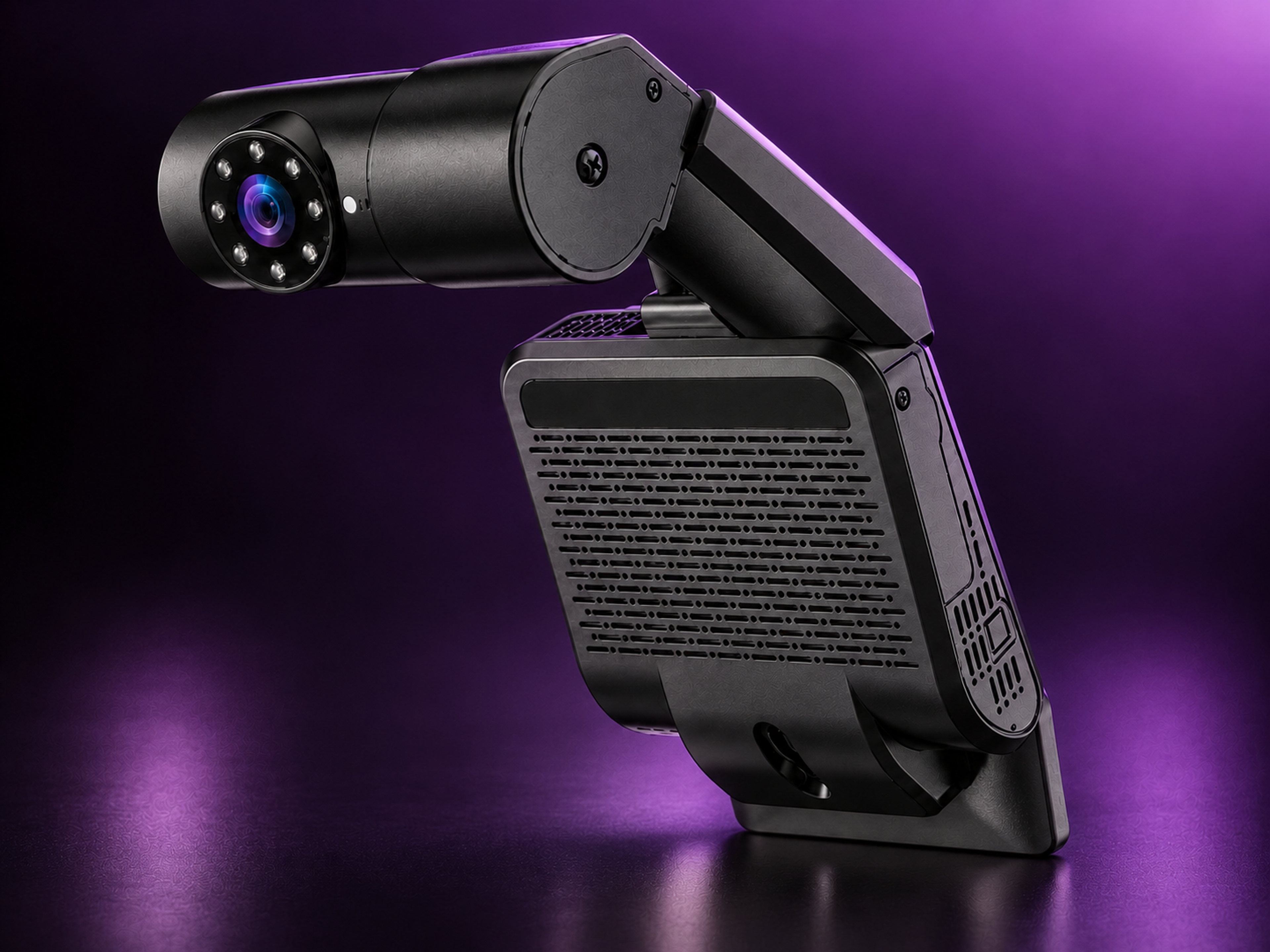 Driver monitoring camera on a plain ground, three-quarter view.
