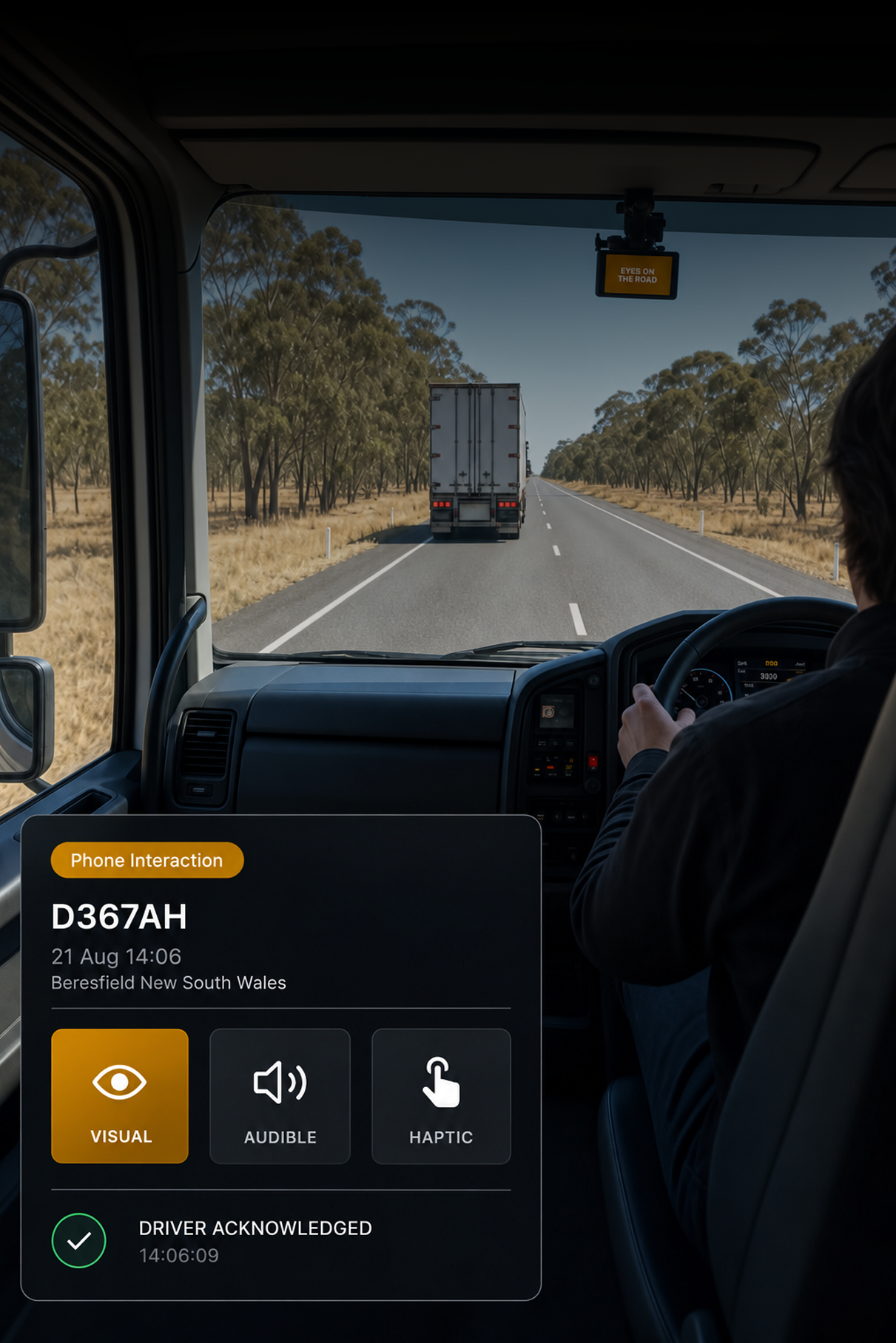 Photograph: a truck cab interior in daylight, the in-cab display lit on the dash, driver in frame from the side. Portrait 3:4, dark and cool, room at the top for a heading, no text in the artwork.